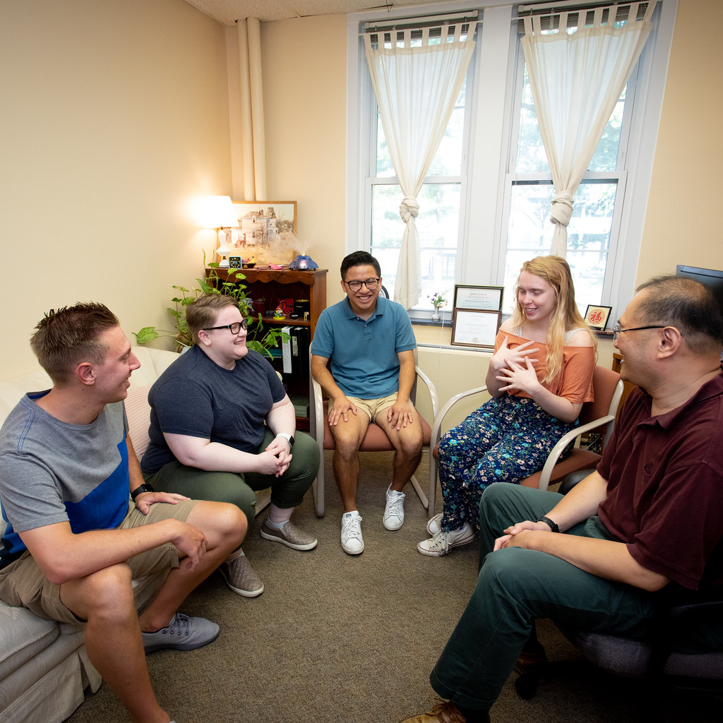 group therapy session with students and counselor