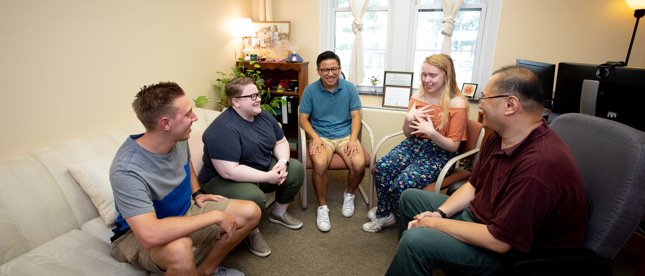 group therapy session with students and counselor